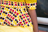 Colorful African print blouse and yellow skirt