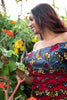 Colorful African print blouse and yellow skirt